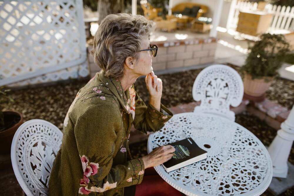 Woman looking off into the distance contemplating what to do.