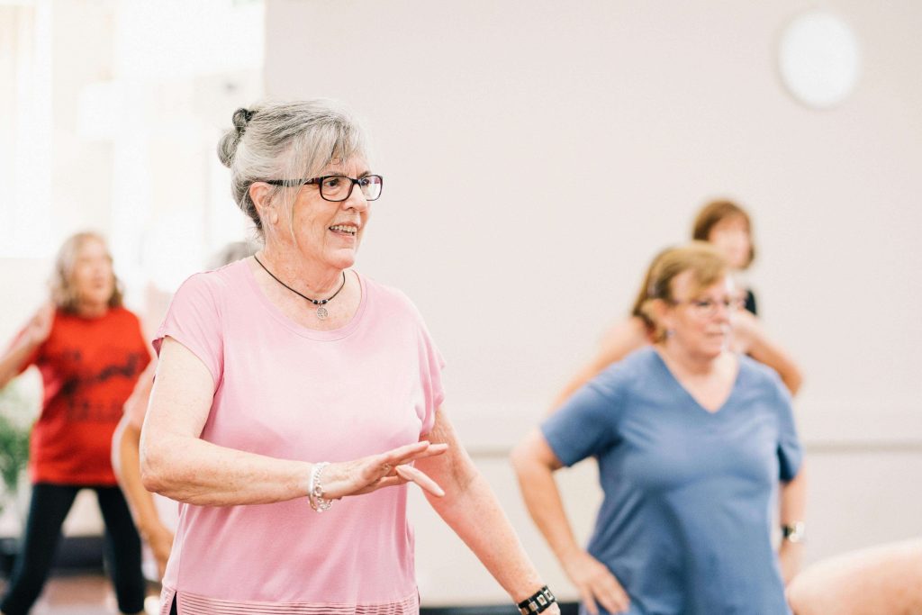 Group of senior women exercising indoors