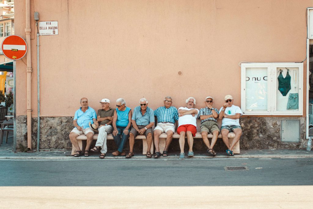 Grouip is seniors sitting together showing social connection